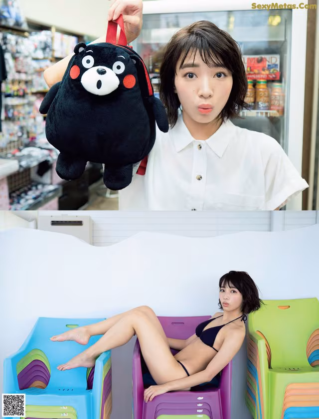 A woman in a white shirt holding a black teddy bear.