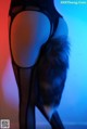 A close up of a woman's butt with a furry tail.